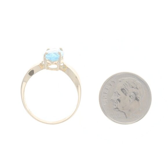 Classic solitaire ring featuring a bezel set, genuine Swiss  Yellow Gold Blue Topaz Cocktail Solitaire Ring - 14k Marquise 2.50ct